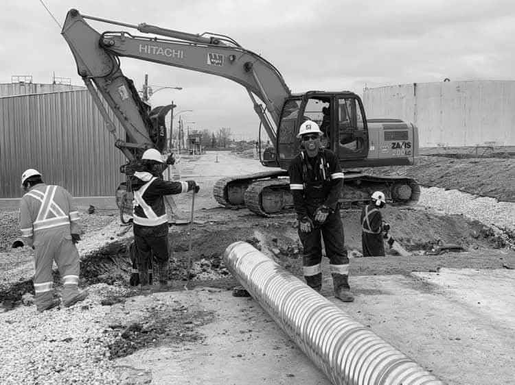 Vintage black and white photo of a 1980s construction team in Canada